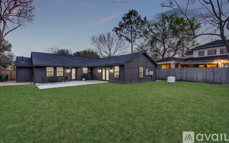 A house with a dark grey exterior is available for purchase.