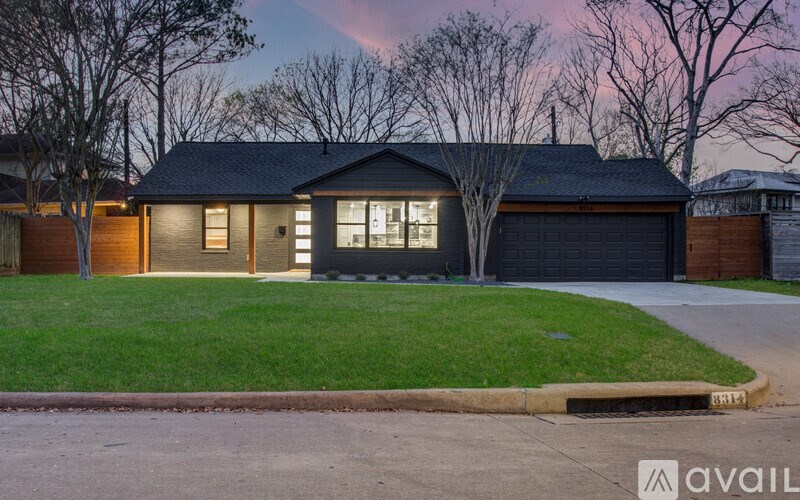 A house with a garage is available for sale.