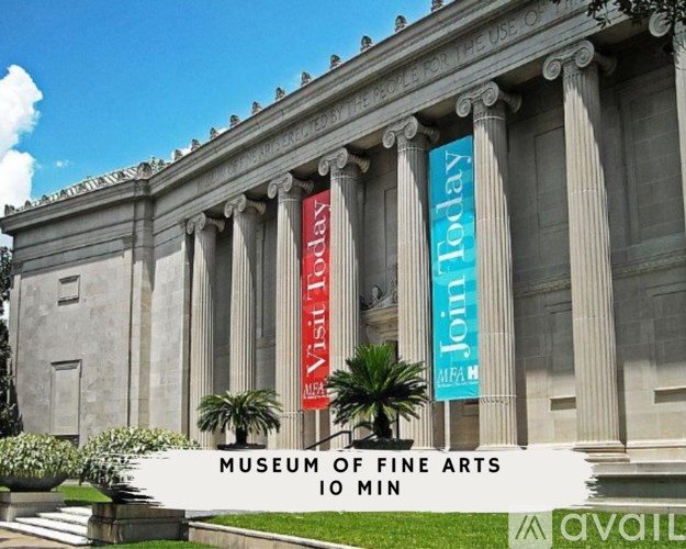 A banner that says "Museum of Fine Arts" is in front of a building.