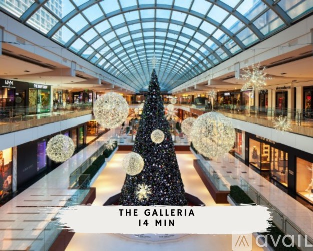A Christmas tree in a mall with the text "The Galleria 14 min".