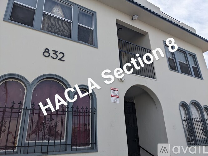 A building with the number 832 and the words "No Application Fee" written on it.