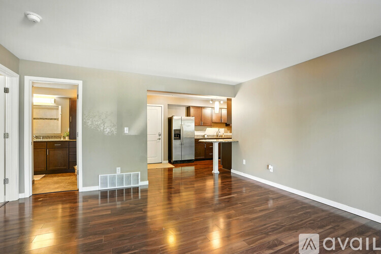 A room with wooden floors and a white ceiling.