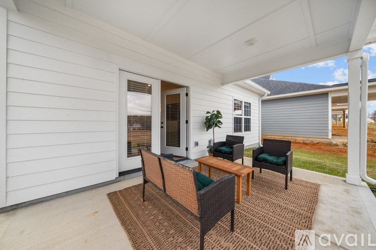 A patio with a table and chairs is shown.