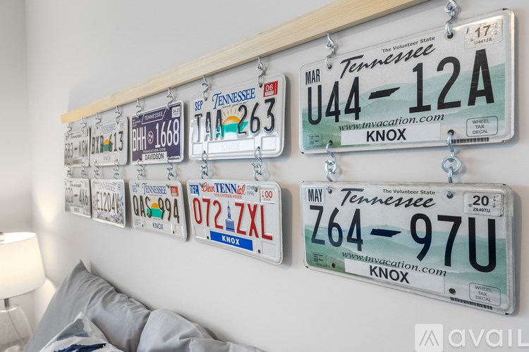 A wall of Tennessee license plates is displayed on a wall.
