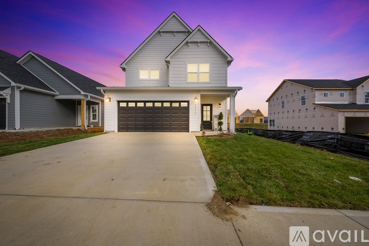 A house with a garage is available for sale.