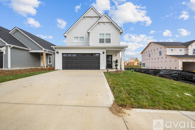 A house with a garage is available for sale.