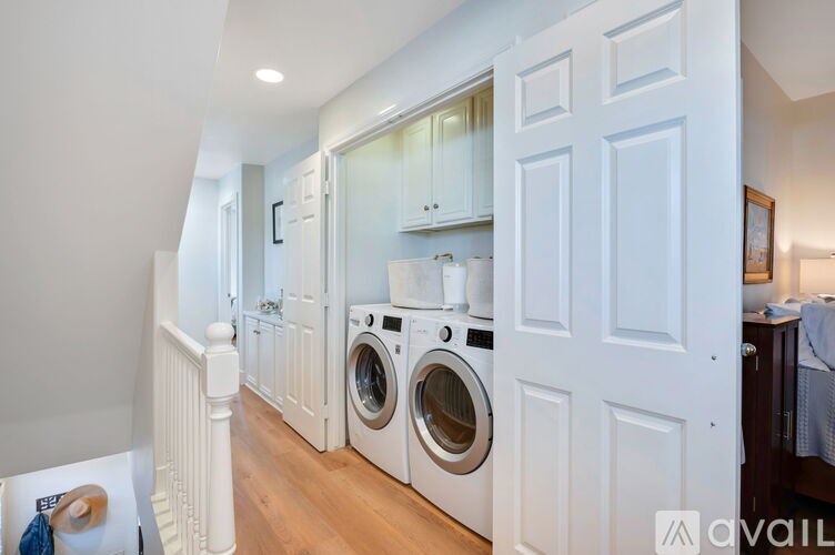 A laundry room with a washer and dryer in it.