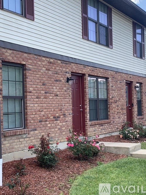 A house with a red door and windows.