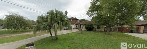 A house with a tower-like structure in the backyard.