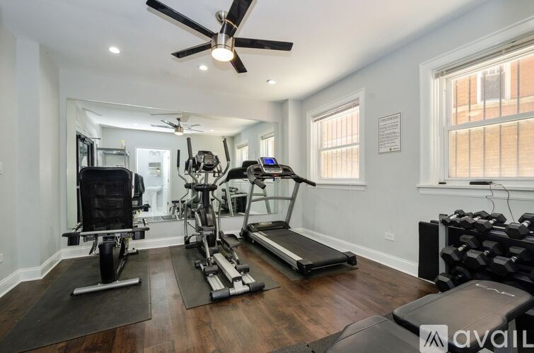 A well-equipped home gym with a variety of exercise machines.