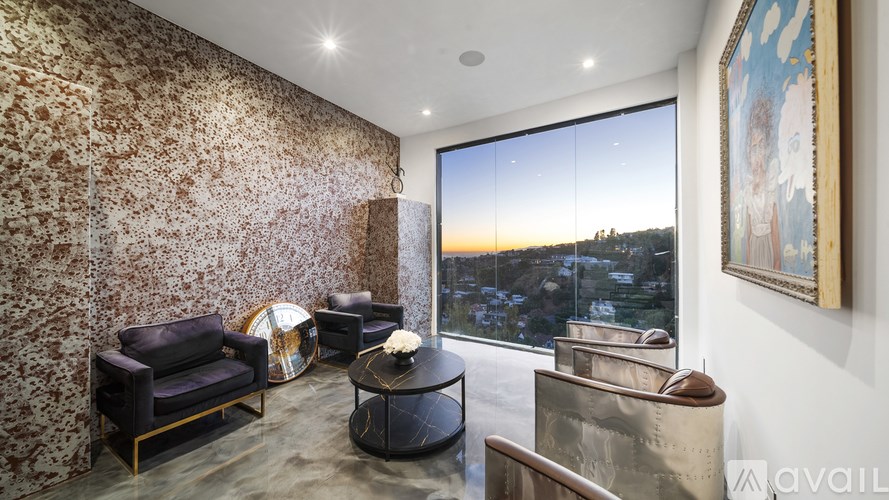 A bottle of champagne is on the bottom shelf of a wine rack.