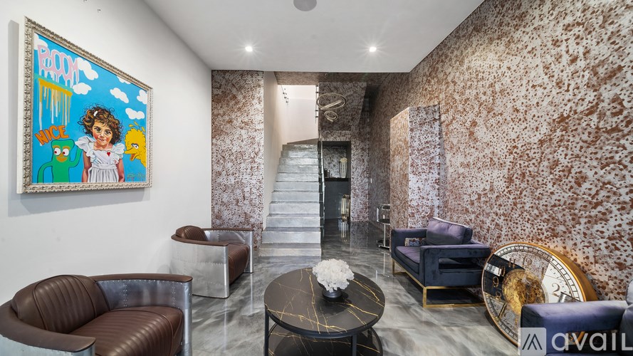 A modern dining area with a glass table and chairs.