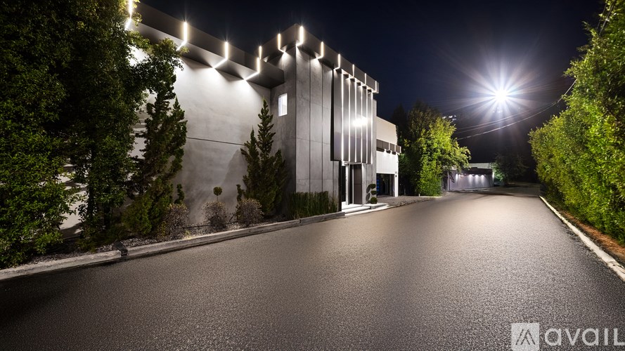 A modern house with a pool in the backyard.