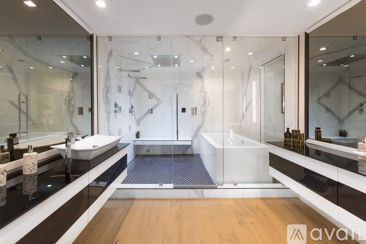 A bathroom with a walk-in shower and a bathtub.