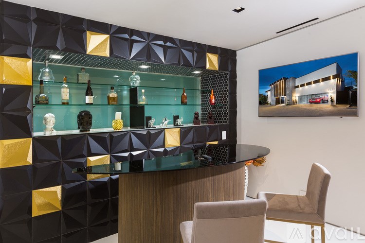 A modern bar with a black and gold design.
