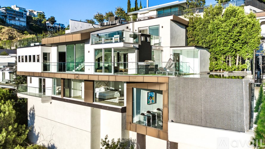 A modern house with a flat roof and large windows.