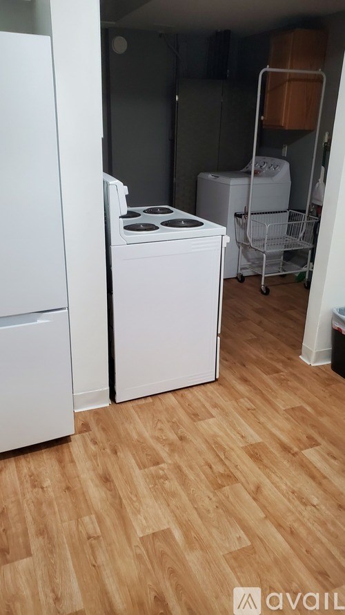A kitchen with a white fridge, a white dishwasher and a white stove.