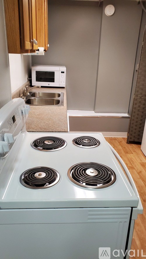 A kitchen with a blue stove top oven.