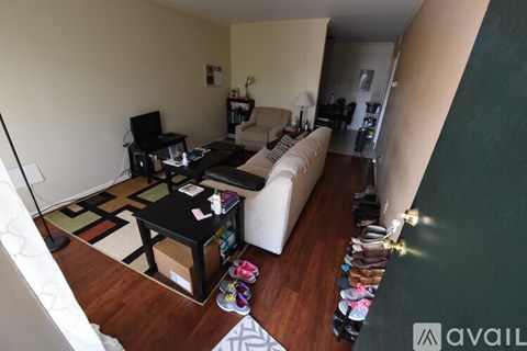 A living room with a white couch and a coffee table.