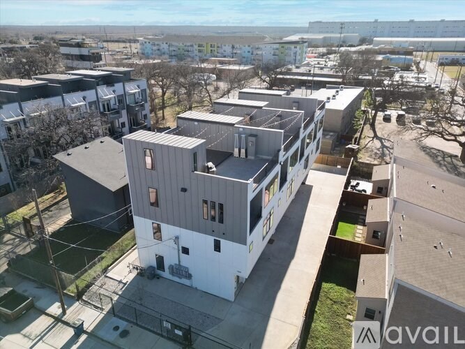 A bird's eye view of a residential area with multiple houses.