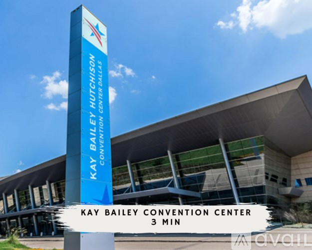 A tall blue sign with the words "Kay Bailey Hutchison Convention Center" on it.
