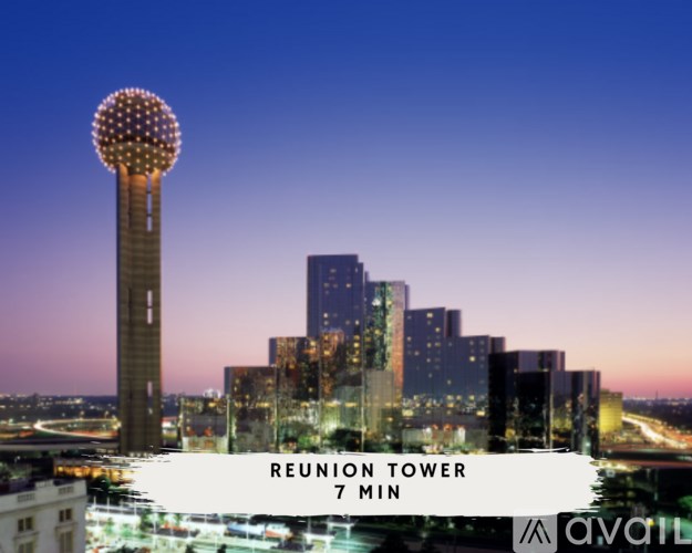 A tall building with a lit up sphere on top is the Reunion Tower in Dallas.
