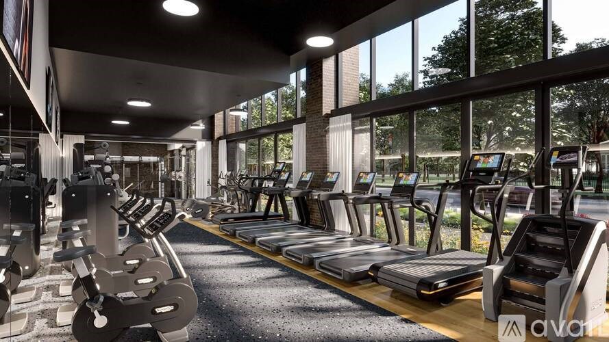 A gym with treadmills, elliptical machines, and other cardio equipment.
