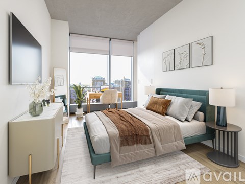 A bedroom with a large bed and a view of the city.