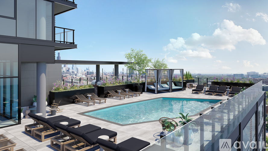 A rooftop pool area with lounge chairs and a view of the city.
