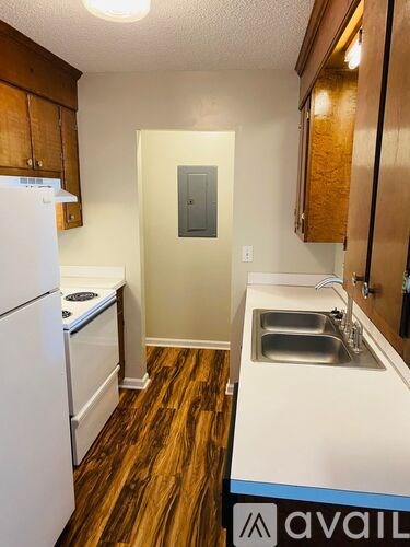 A bathroom with a toilet, sink, and bathtub.
