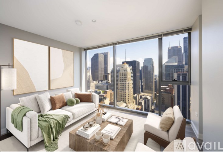 A living room with a view of the city skyline.