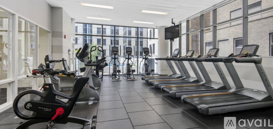 A gym with treadmills and exercise bikes.