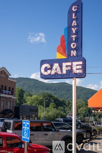 Clayton Cafe sign with a mountain in the background.