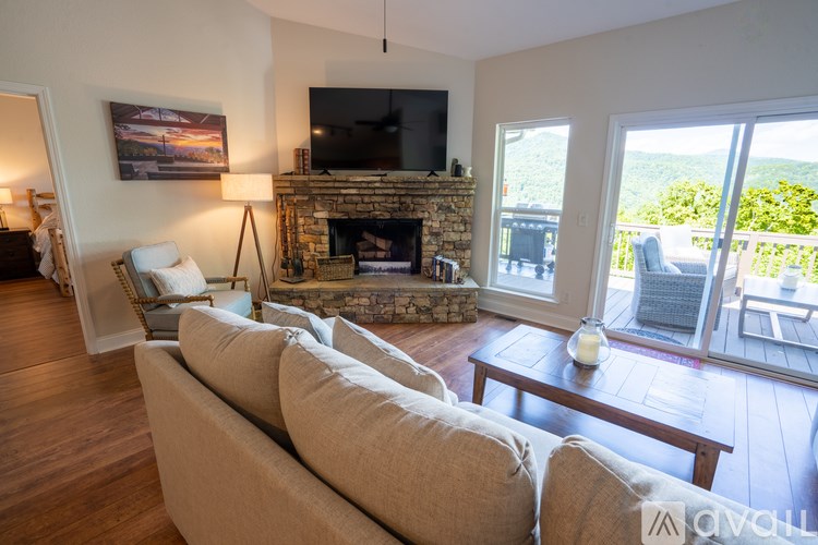 A living room with a fireplace and a couch.