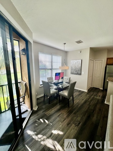A dining room with a table and chairs is shown.