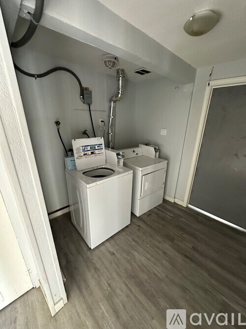 A laundry room with a washer and dryer.