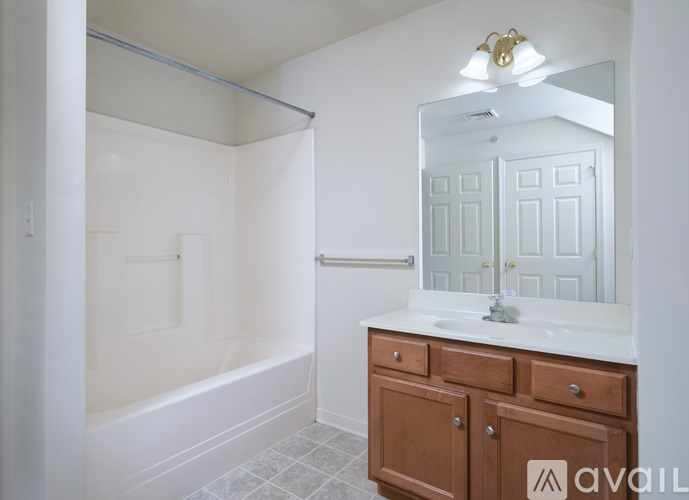 A small bathroom with a washer and dryer.