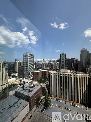 A cityscape with a clear sky and buildings of various heights.