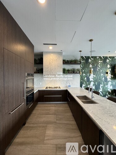 A modern kitchen with wooden cabinets and a countertop.