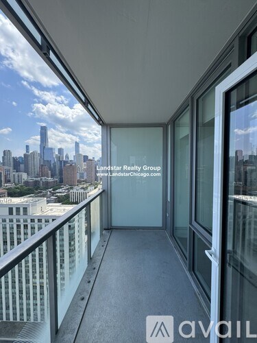 A balcony with a view of the city skyline.