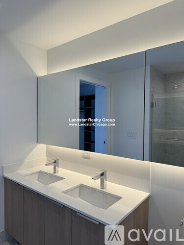 A bathroom with a vanity and a mirror.