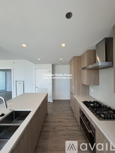 A modern kitchen with wooden cabinets and a stainless steel stove.