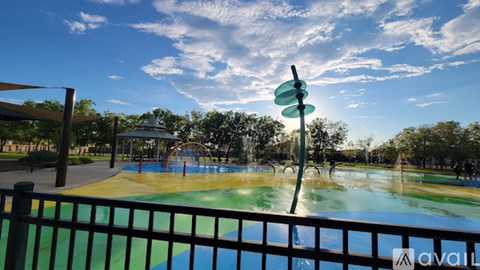 A playground with a slide and a pool.
