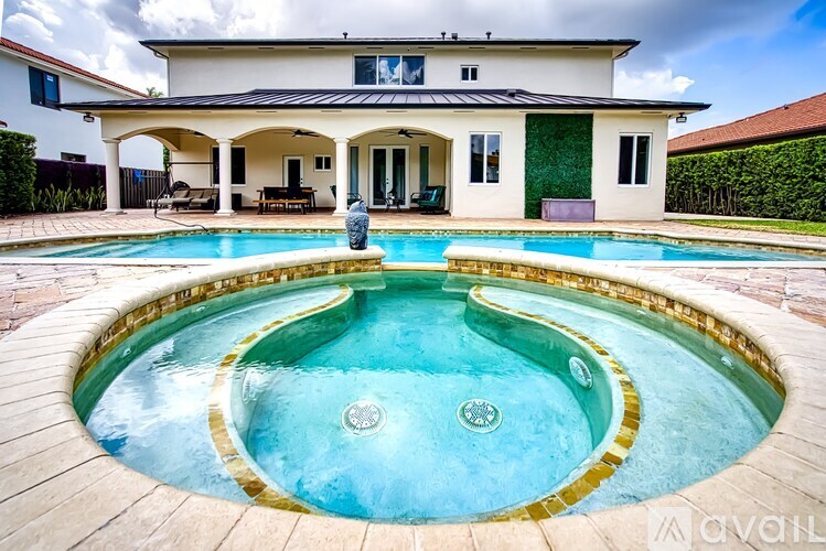 A house with a pool in the backyard.