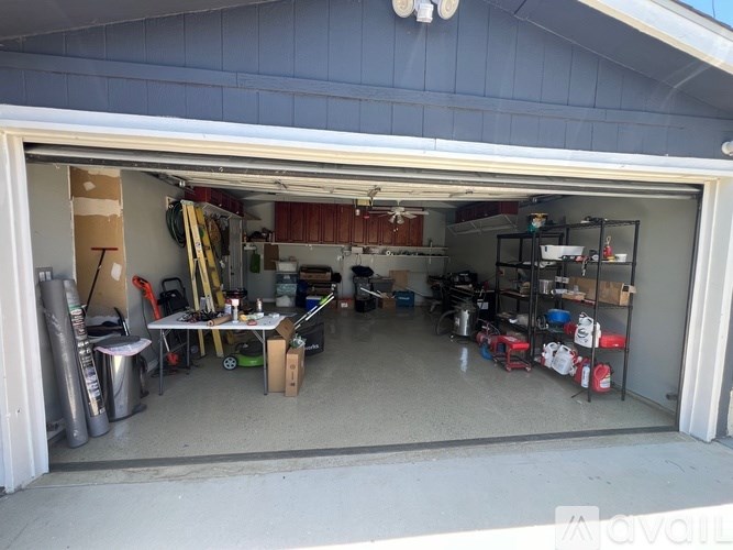A garage with a lot of tools and equipment.