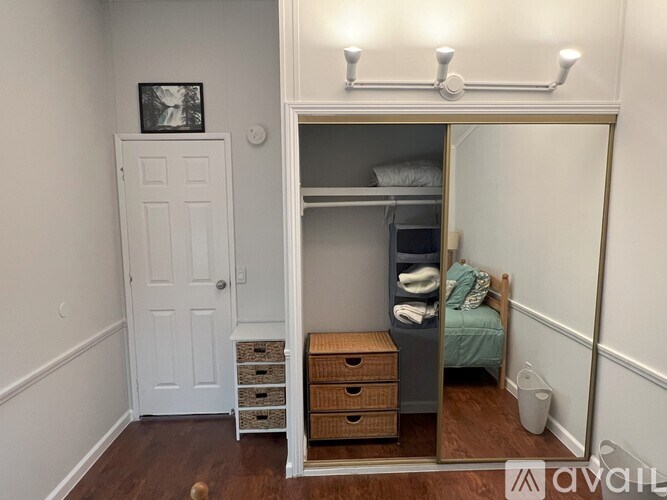 A small bedroom with a bunk bed and a dresser.