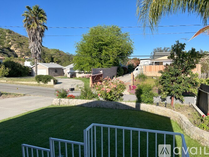 A residential area with houses and greenery.