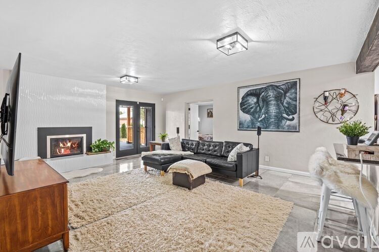 A living room with a fireplace and a couch.