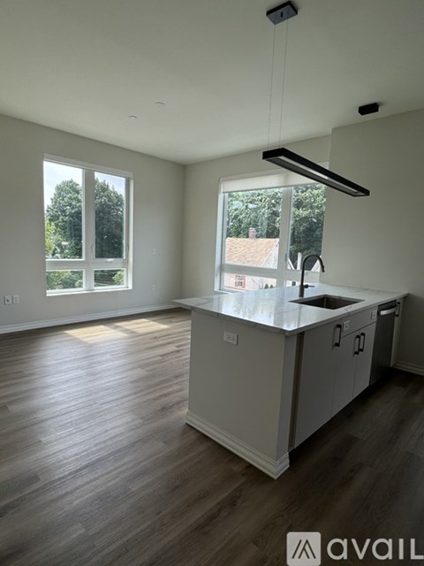 A kitchen with a sink and cabinets is available for rent.