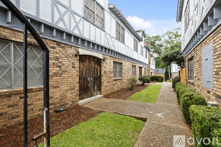 A narrow alley between two buildings with a sign that says "available" in the bottom right corner.